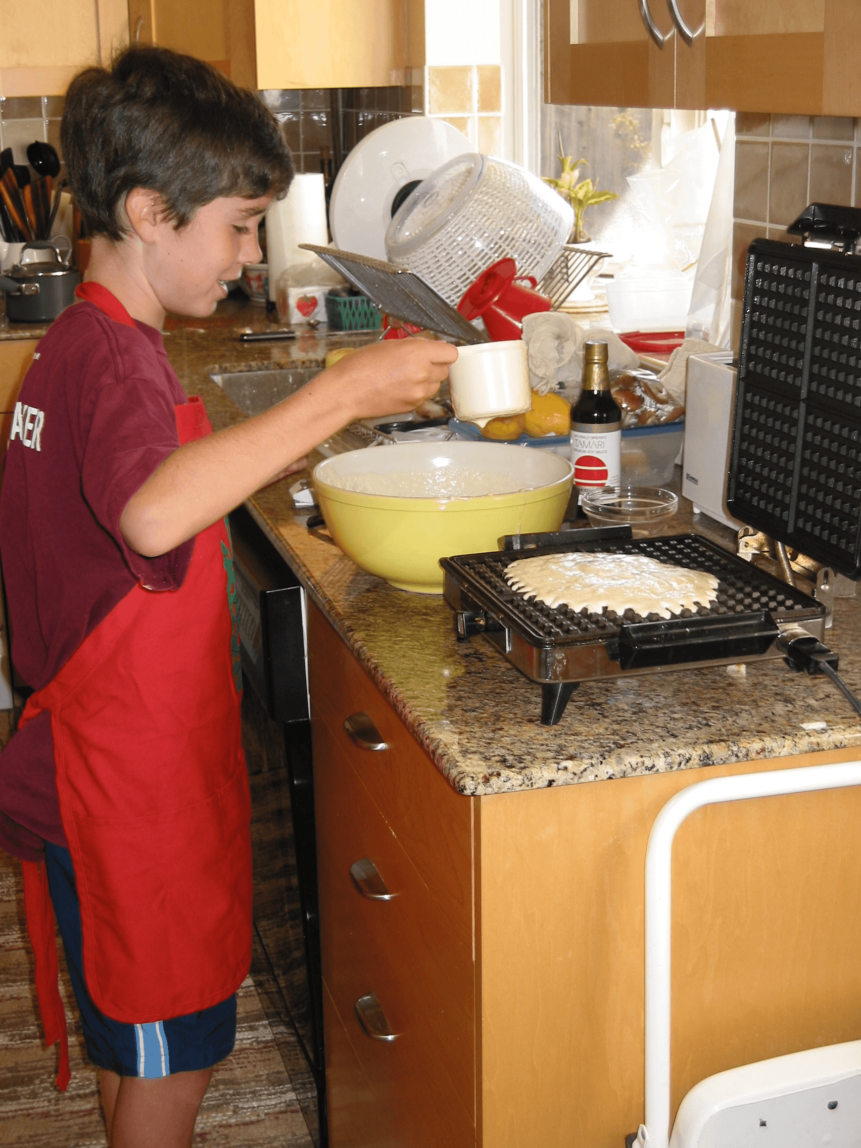 Kid making waffles